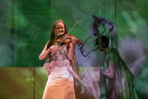 Kathleen Nisbet playing fiddle  Cole Alvis as Mistatim in YOU USED TO CALL ME MARIE...photo by Emily Cooper
